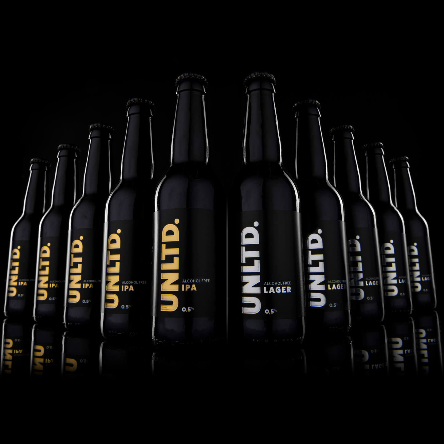 Row of black beer bottles with 'UNLTD.' branding on a black background